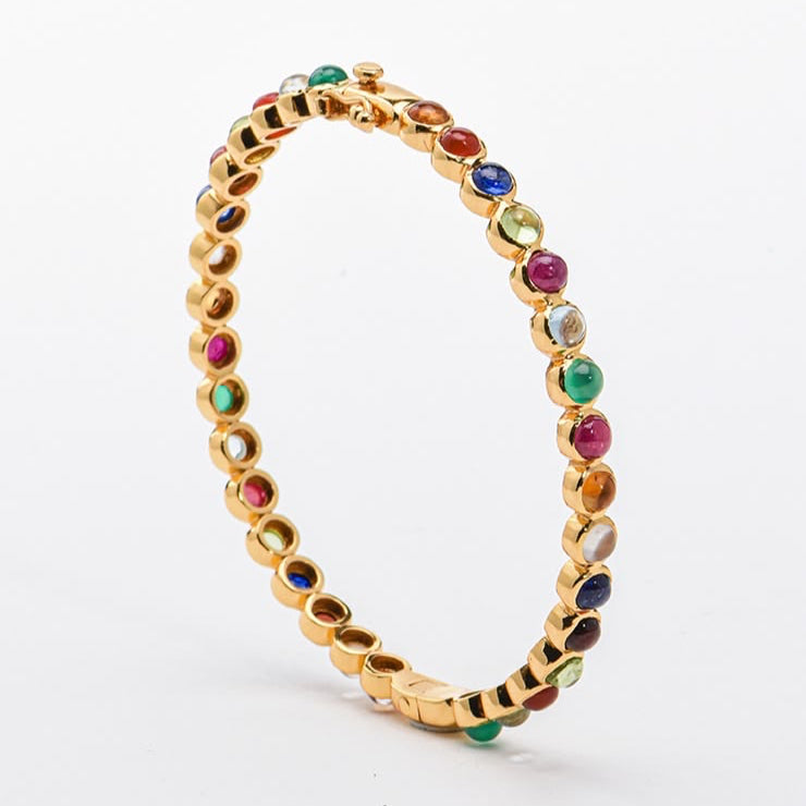 vermeil bracelet with multicolored natural gemstones on a white background, branded 'Kanohsilp Jewelry Studio'.