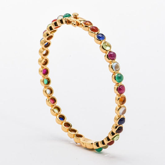 vermeil bracelet with multicolored natural gemstones on a white background, branded 'Kanohsilp Jewelry Studio'.